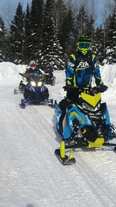 Snowarama riders coming in to the bonfire at the Mineral Center during Snowarama 2019 - Photo by Rhonda Silence