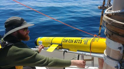 Hjordis Captain Matt Ecklund checks out the glider Gitchigami before it was launched