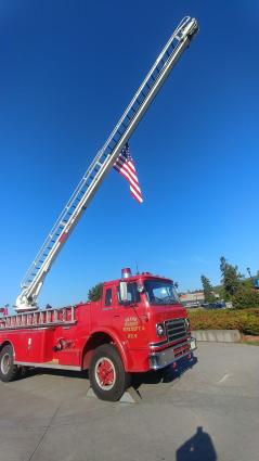 The Grand Marais Fire Department's ladder truck with the flag at half-mast in remembrance of September 11, 2001