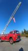 The Grand Marais Fire Department's ladder truck with the flag at half-mast in remembrance of September 11, 2001