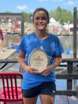 Allie Duclos of Lutsen with the first place, world championship trophy at the Hayward Lumberjack Championship. Submitted photo