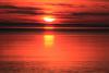 Rising sun over Lake Superior by Travis Novitsky