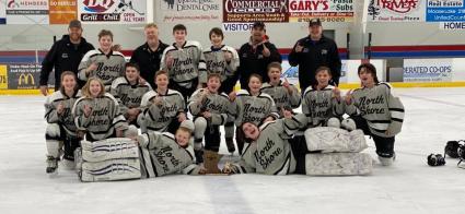 The North Shore Storm PeeWee B team celebrates winning the regional championship. Photo by Casey Bronikowski