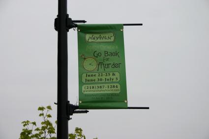 Grand Marais Playhouse productions are often featured on banners in downtown Grand Marais. File photo Rhonda Silence