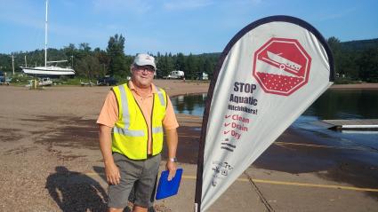 Aquatic Invasives Species Inspector Scott Brown on the job at the Grand Marais Rec Park - Photo by Rhonda Silence