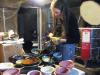 Ann Ward unloads a kiln full of bowls for the upcoming fundraiser/photo by Joan Farnam