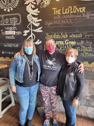 Christina Conroy, center, moments after she was cleared for a loan to get a new food truck in Grand Marais. Submitted photo