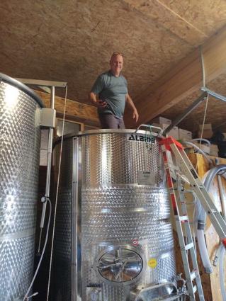 Chuck Corliss stomps grapes at North Shore Winery. Submitted photo