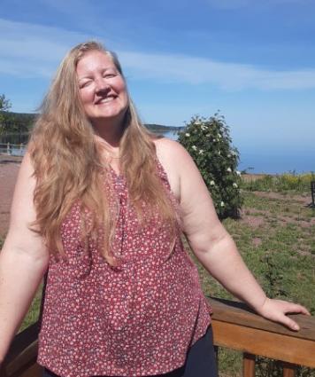 Cook County Historical Society President Marja Erickson on the sunny deck at the historical society museum. Submitted photo