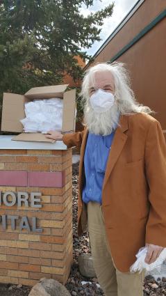 Frank Ceo with KN95 respirator masks for North Shore Health. Photo by Rhonda Silence