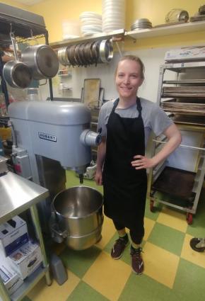 Hana Crosby with the huge Hobart mixer she will put to good use at Crosby Bakery. Photo by Rhonda Silence