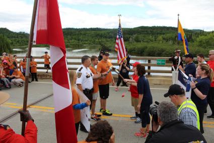 The torch exchange at the U.S.- Canadian border - Photo courtesy of Valerie Marasco, Cook County