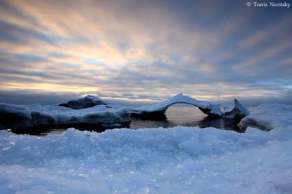 Ice Arch Sunrise by Travis Novitsky