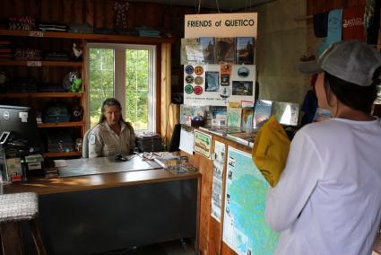 Cache Bay Ranger Janice Matichuk talks with a Quetico paddler. All photos by Joe Friedrichs