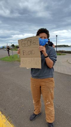 A Justice for George Floyd pop-up rally lined Highway 61 in Grand Marais on May 29. Photo by Rhonda Silence