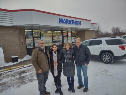 New Marathon owners Sam and Sabby Bains with former owners, Lynn and Craig Schulte. Photo courtesy of Steve Bragg, Calhoun 