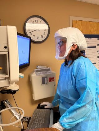 RN Melanie Allen, in full personal protective equipment, at work in the COVID unit. Photo courtesy of Sanford Health