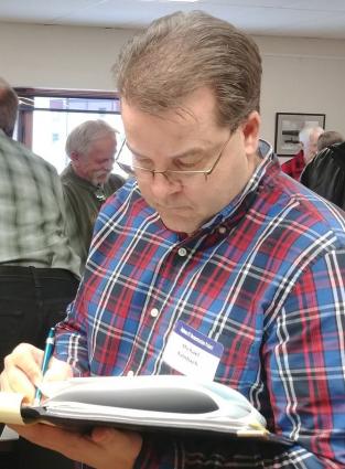 Michael Kalnbach of MnDOT takes notes at a City of Grand Marais Open House in Feb. 2018  (Photo by Rhonda Silence