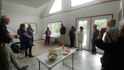 Community members at a September 2018 open house for a One Roof Community Housing Nordic Star home. Photo Rhonda Silence