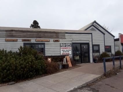 A building for sale sign went up on the North Shore Pharmacy building this week. Photo by Rhonda Silence, WTIP