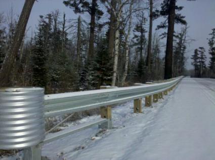 metal guardrails line a stretch of the Gunflint Trail, photo by Stephan Hoglund