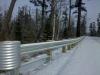 metal guardrails line a stretch of the Gunflint Trail, photo by Stephan Hoglund