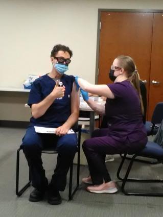 RN Rob Wells gets his second COVID-19 shot from LPN Mary Edson 01-12-21 Submitted photo