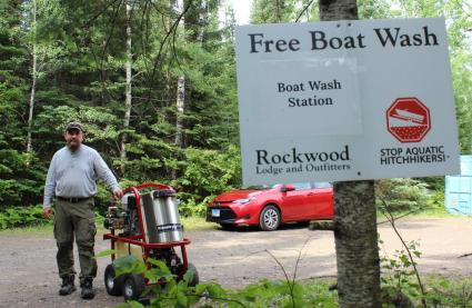 Carl Madsen at Rockwood Lodge with Cook County's invasive species pressure washer. Photo by Joe Friedrichs