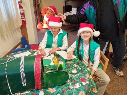 Cook County Girl Scouts--like these girls at a past event--are once again hosting Santa's Workshop. 