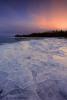 Sheet ice at sunset - Red Rock Beach, Grand Portage by Travis Novitsky