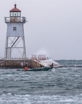 Tyler Smith and Eric Brisson heading out to check nets. Photo by David R. Johnson Photography