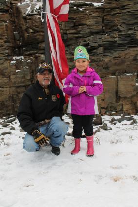 Grand Portage Royalty's Tiny Tot Princess Naveah lent encouragement as the flags were raised. 