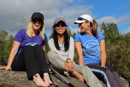 Beth Hillenbrand (left), Janice Yee and Nicole Wozniak relax at Caribou Lake. Photo by Joe Friedrichs