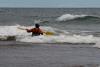 Bryan Hansel kayaks out for more surf near the mouth of the Brule River on Lake Superior