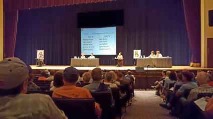 Forest Service staff listen to public comment at the Duluth Convention Center. Photo by Ann Possis